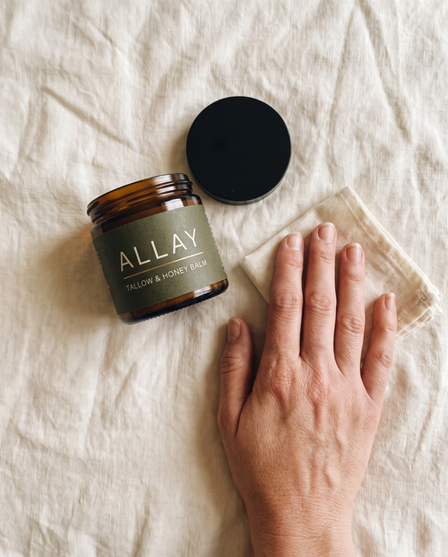 Allay flat-lay with hand